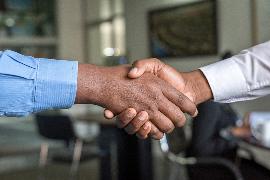 Technical Specification Document can lead to successful business partnerships A handshake with a well-written technical spec as a start of successful software development partnership
